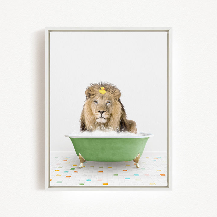 A lion is sitting in a green bathtub filled with bubbles, with a rubber duck floating on its head.