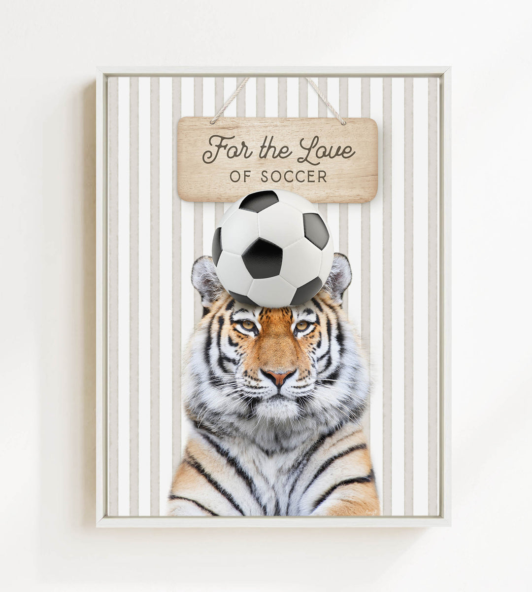 A tiger is standing in front of a sign that says "For the Love of Soccer".