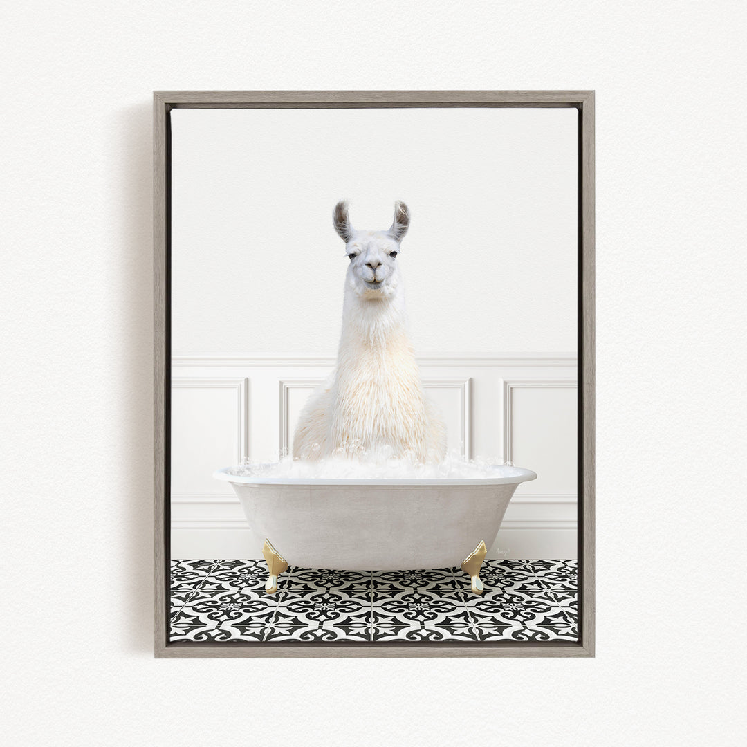 A white llama sitting in a white bathtub filled with bubbles, surrounded by a black and white patterned floor.