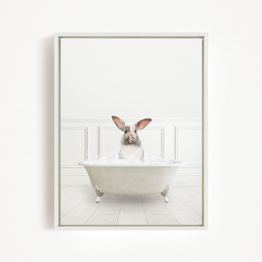 A white rabbit sitting in a white bathtub filled with water, with its head above the water's surface.