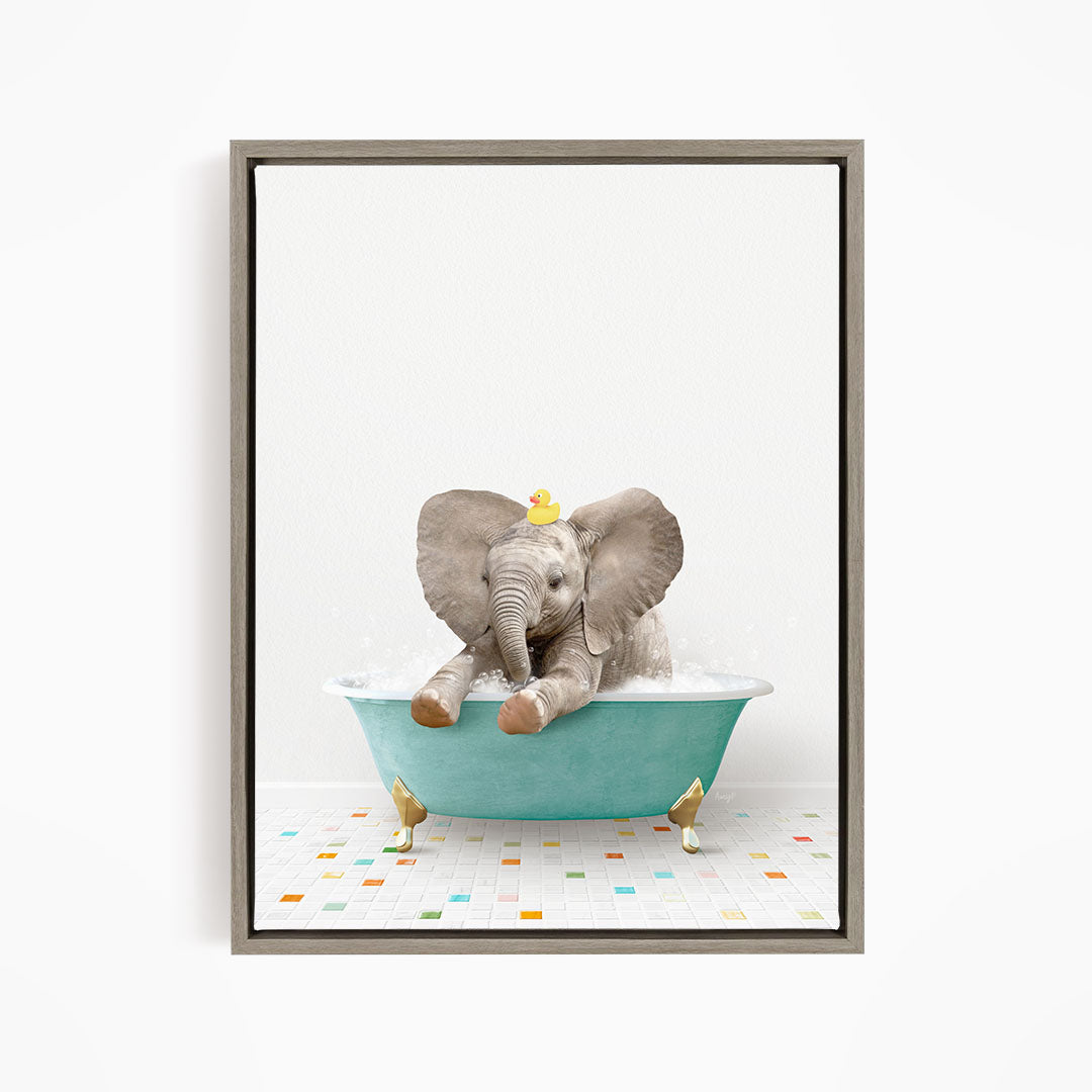 A baby elephant sitting in a blue bathtub, with a yellow rubber duck on its head, and a colorful tiled floor in the background.