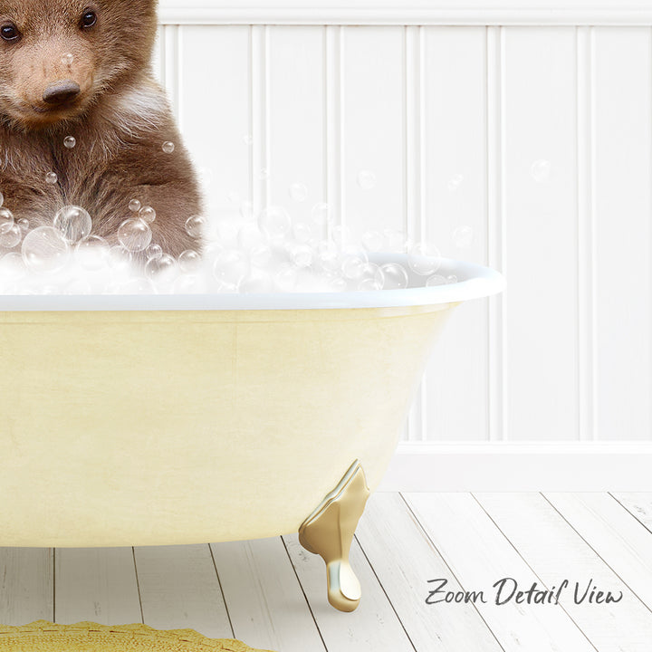 A brown bear sitting in a yellow bathtub filled with bubbles, with a white wall and wooden floor in the background.