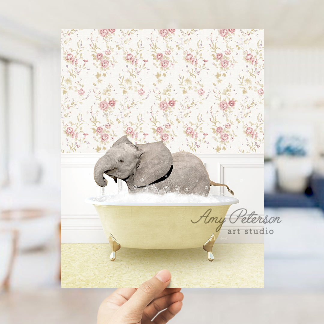 a person holding up a card with an elephant in a bathtub