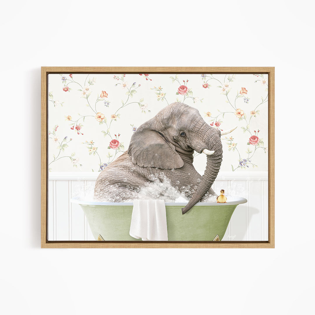 A gray elephant is sitting in a green bathtub, surrounded by a floral patterned wall.
