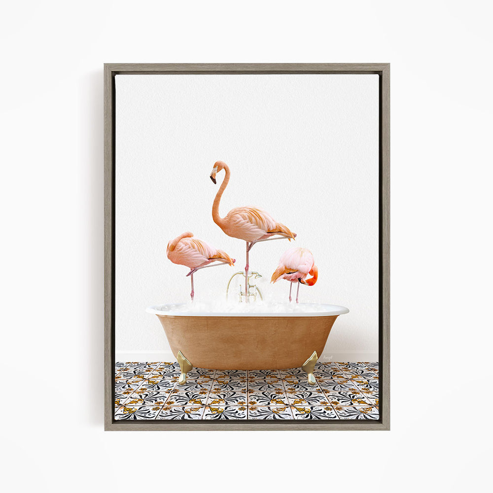 A framed image depicting three pink flamingos standing in a bathtub filled with water.