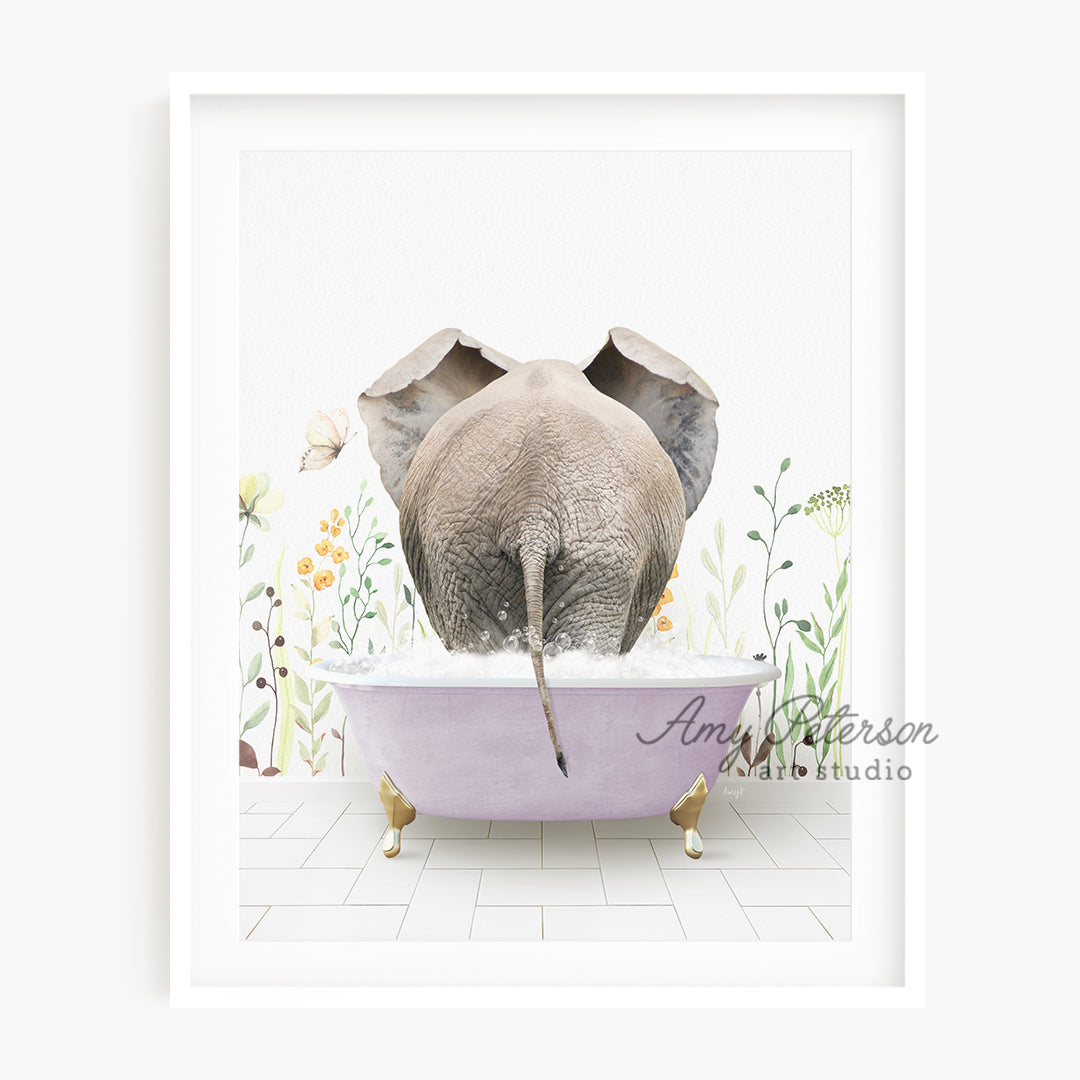 a picture of an elephant taking a bath