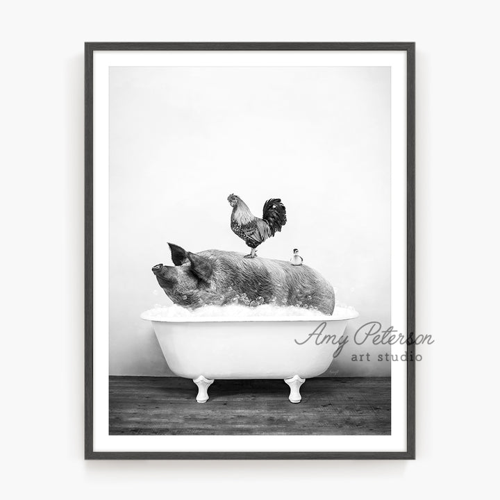 a black and white photo of a pig in a bathtub