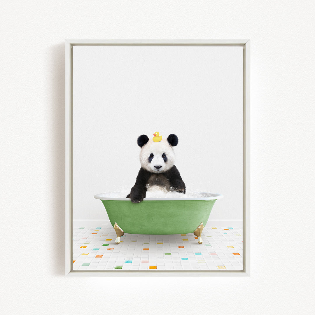 A panda bear sitting in a green bathtub filled with bubbles, with a rubber duck floating on the water.