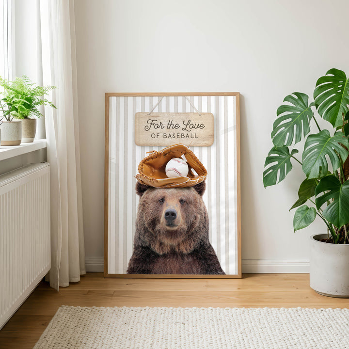 A framed poster featuring a brown bear wearing a baseball glove and a baseball cap, with the text "For the Love of Baseball" displayed on the poster.