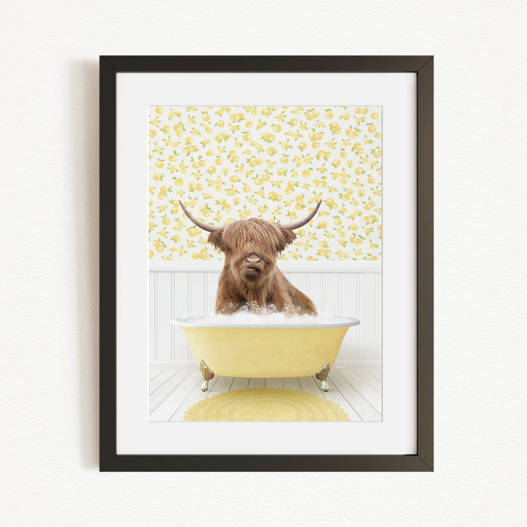 A brown cow with long horns is sitting in a yellow bathtub, surrounded by a yellow floral pattern on the wall behind it.