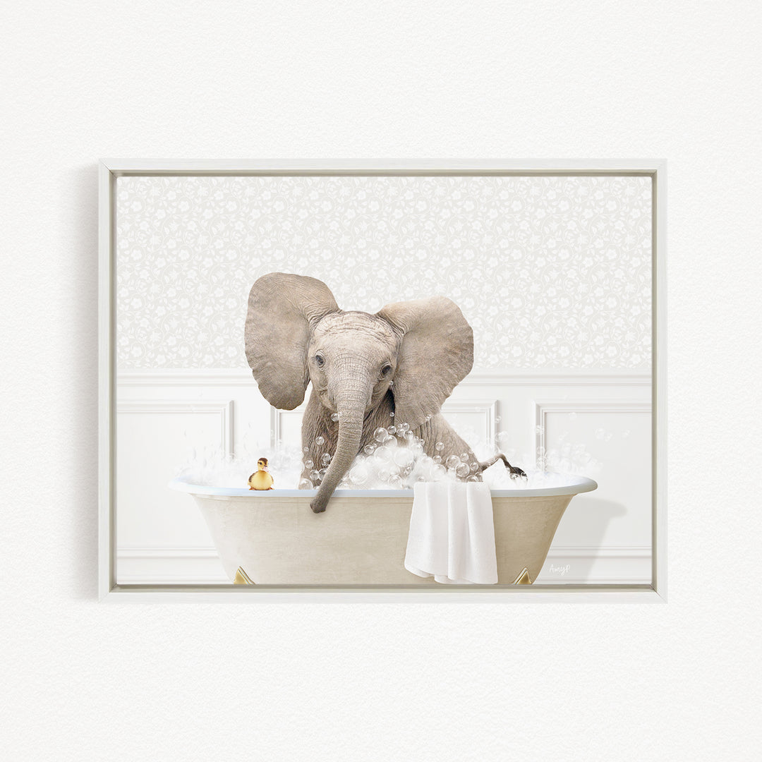 A baby elephant sitting in a bathtub filled with water, surrounded by bubbles and a small toy.