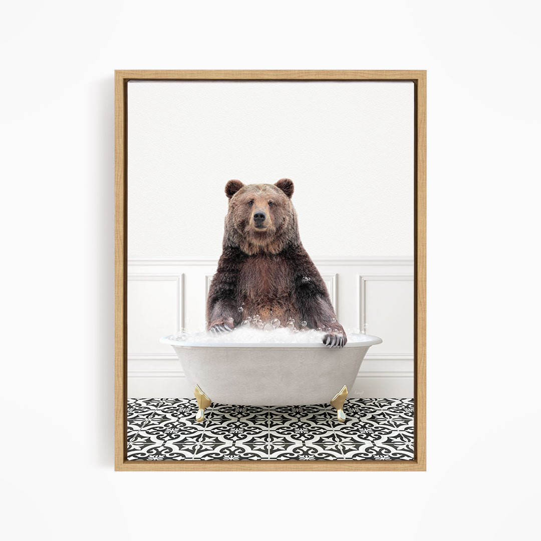 A brown bear sitting in a white bathtub filled with water, surrounded by a black and white patterned floor.
