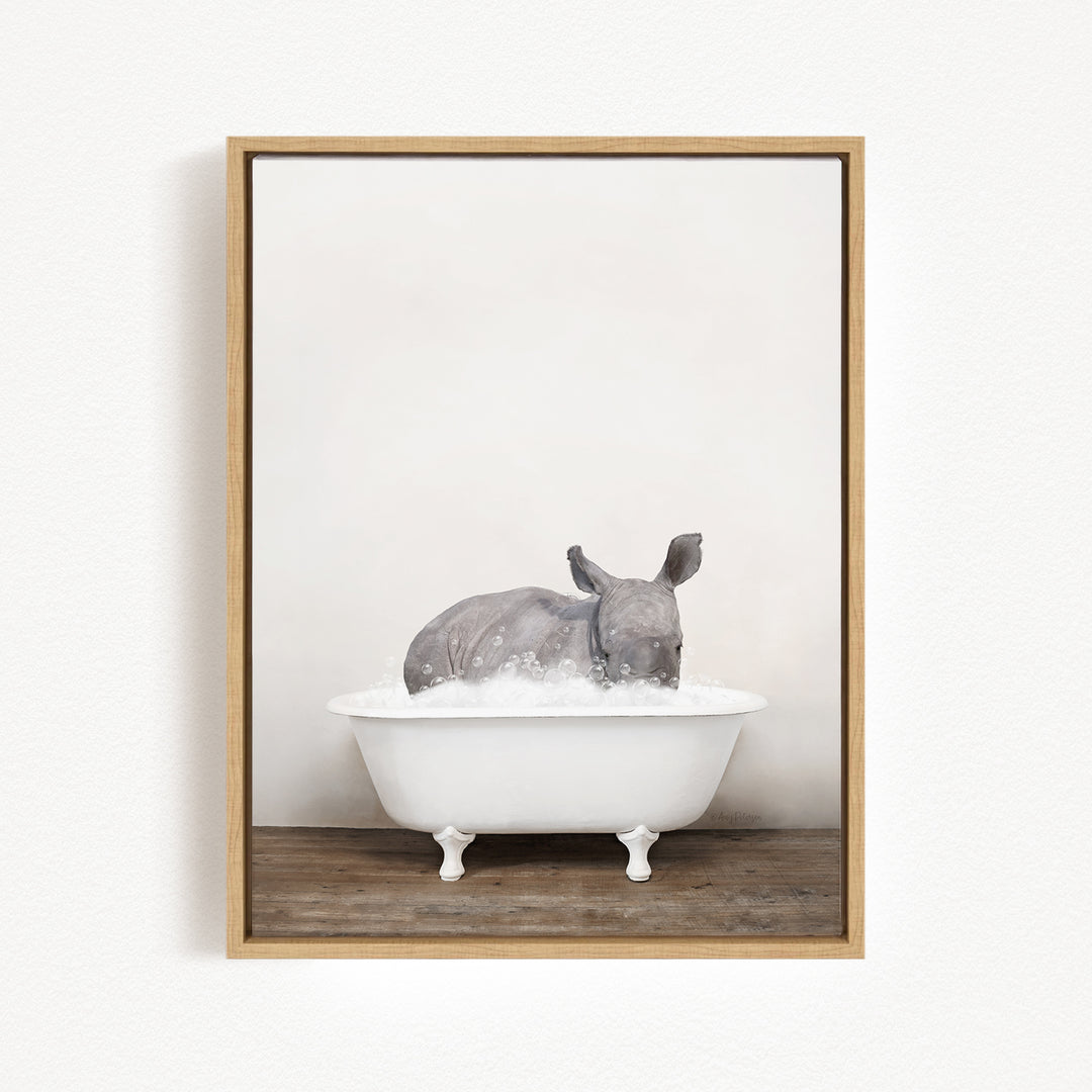A rhinoceros is sitting in a white bathtub filled with water, creating a whimsical and playful scene.