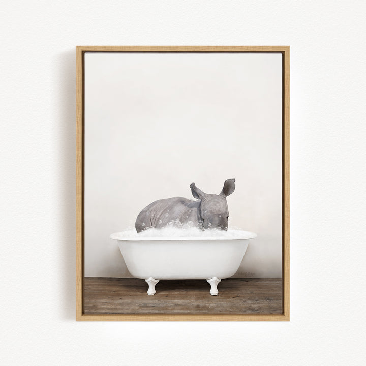 A rhinoceros is sitting in a white bathtub filled with water, creating a whimsical and playful scene.