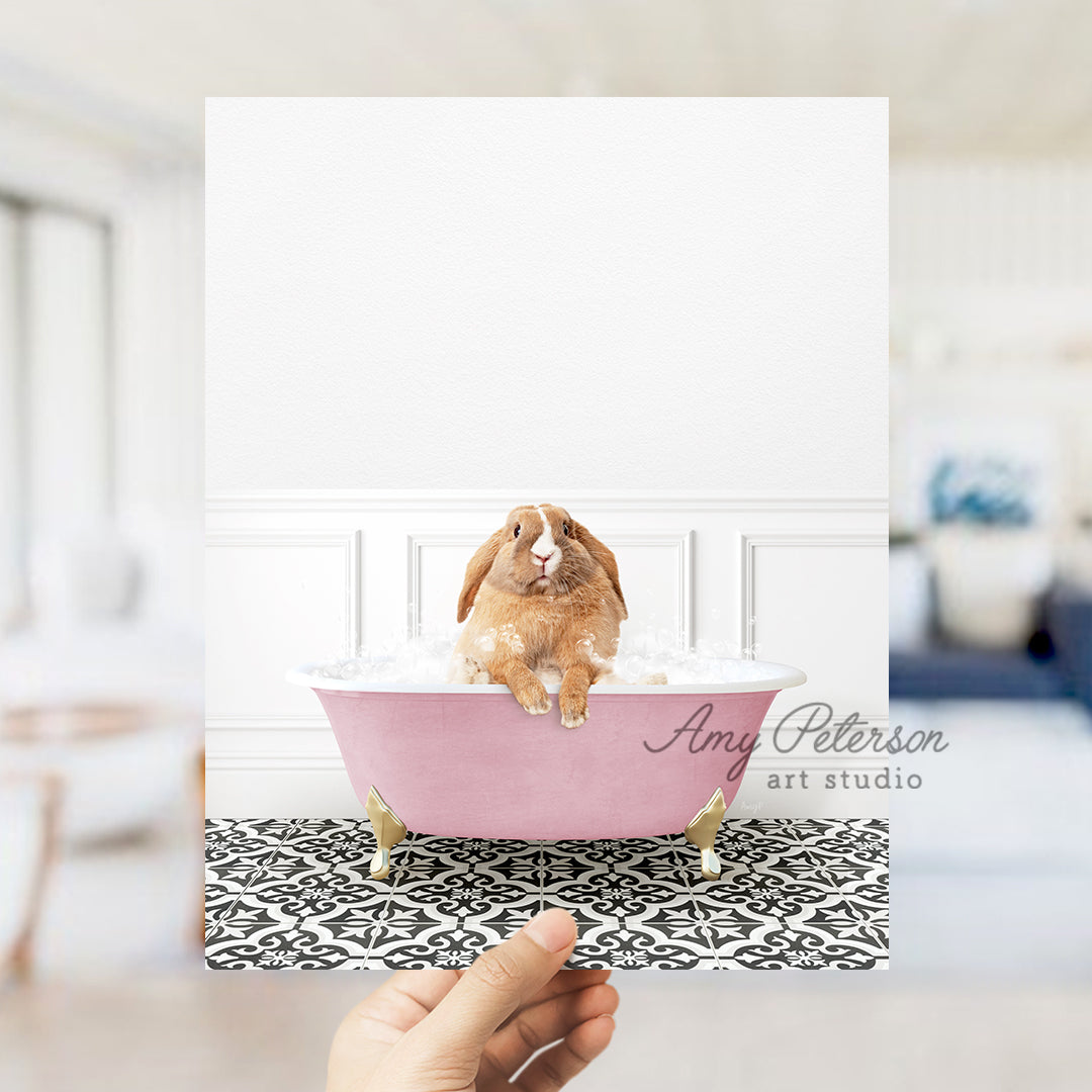 a person holding a card with a picture of a rabbit in a bathtub