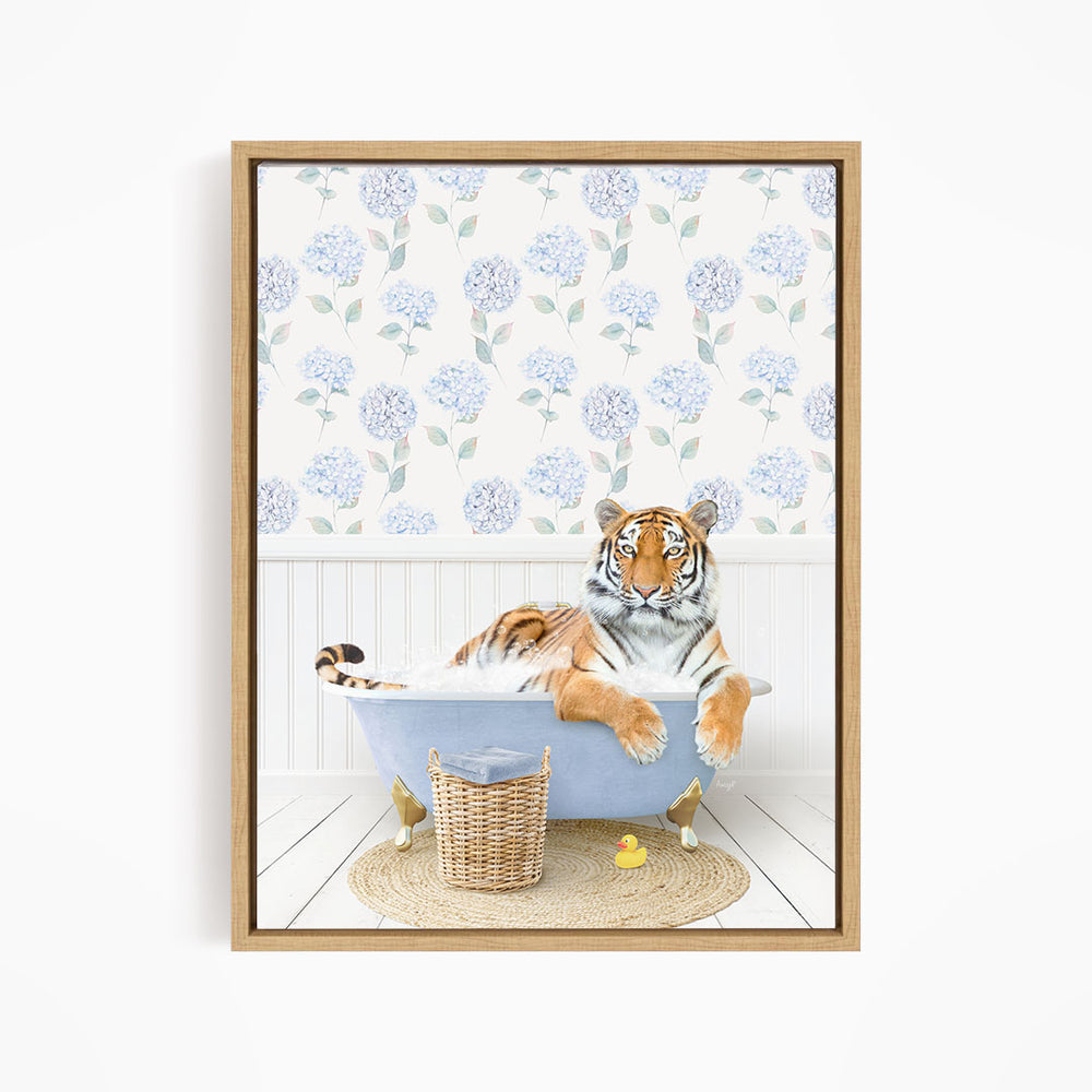 A tiger is sitting in a bathtub filled with water, surrounded by a wicker basket and rubber ducks.