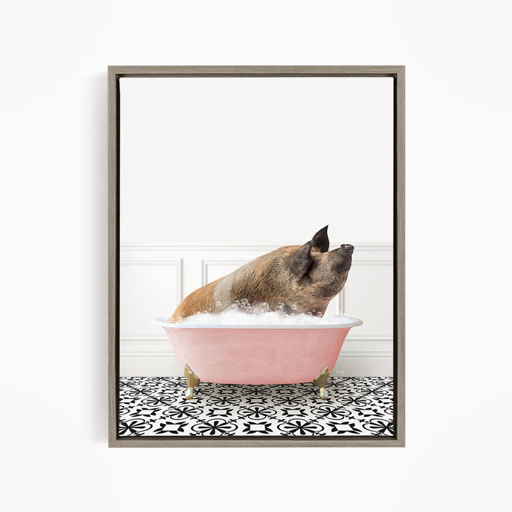 A brown pig sitting in a pink bathtub filled with bubbles, looking up at the camera.