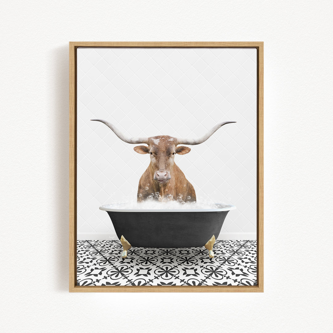 A brown bull with long horns is sitting in a black bathtub filled with water, creating a whimsical and playful scene.