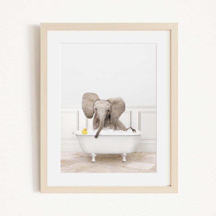 A baby elephant sitting in a white bathtub, surrounded by rubber ducks.