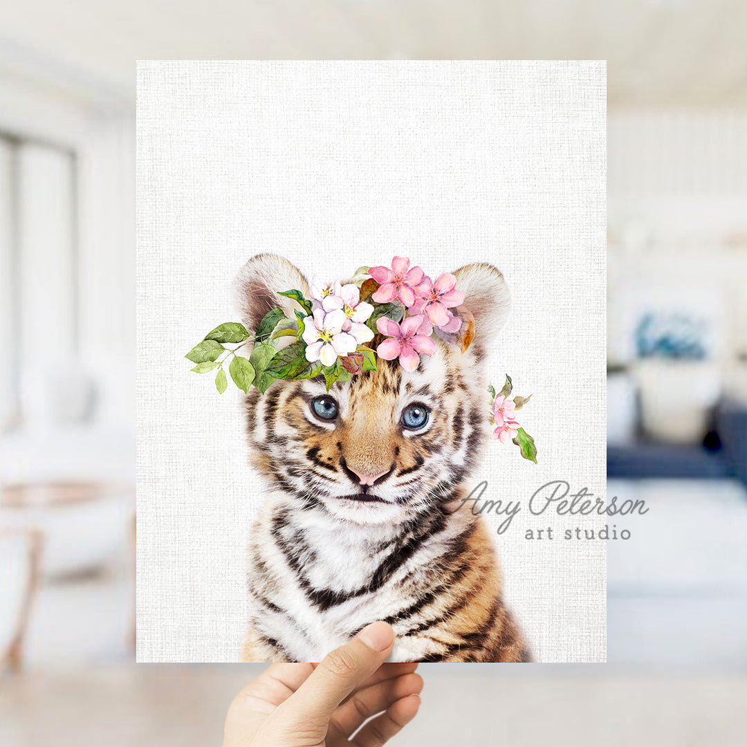 a hand holding up a card with a picture of a tiger