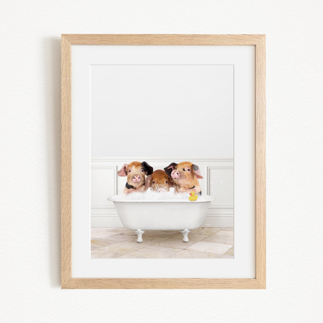 Three adorable pigs sitting in a white bathtub, enjoying a relaxing bath.
