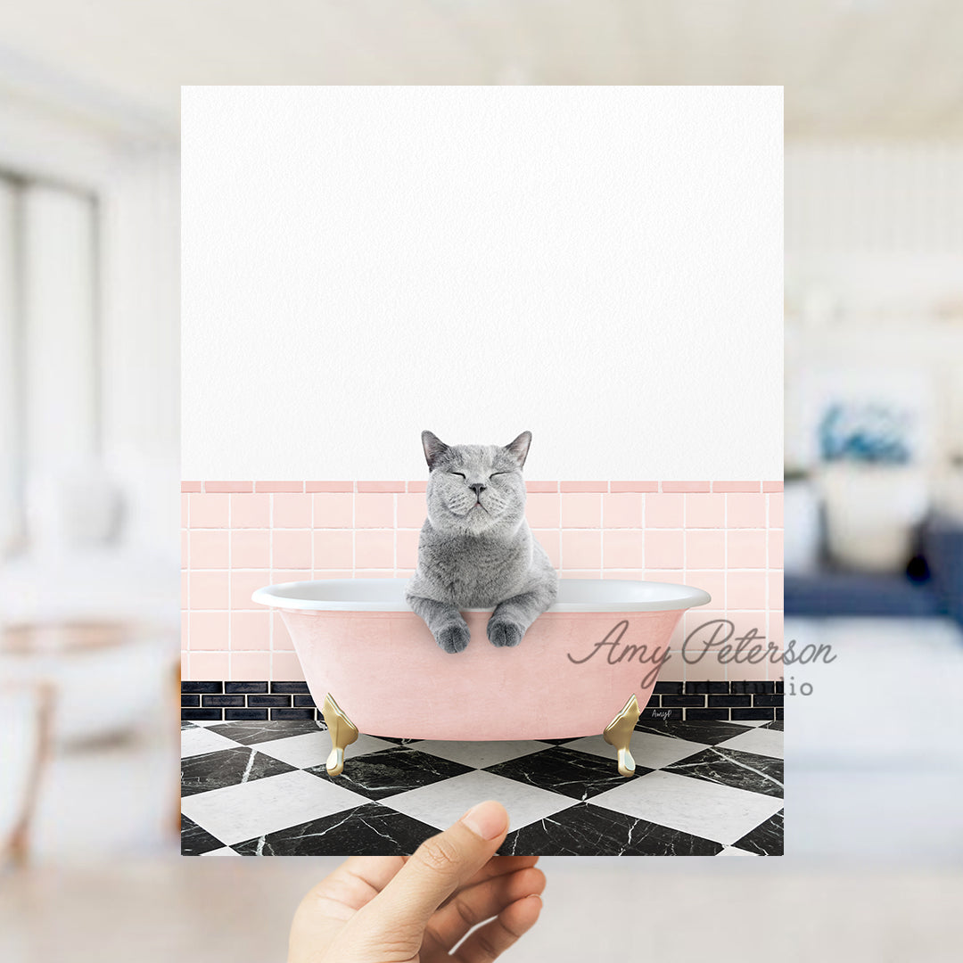 a person holding up a card with a picture of a cat in a bathtub