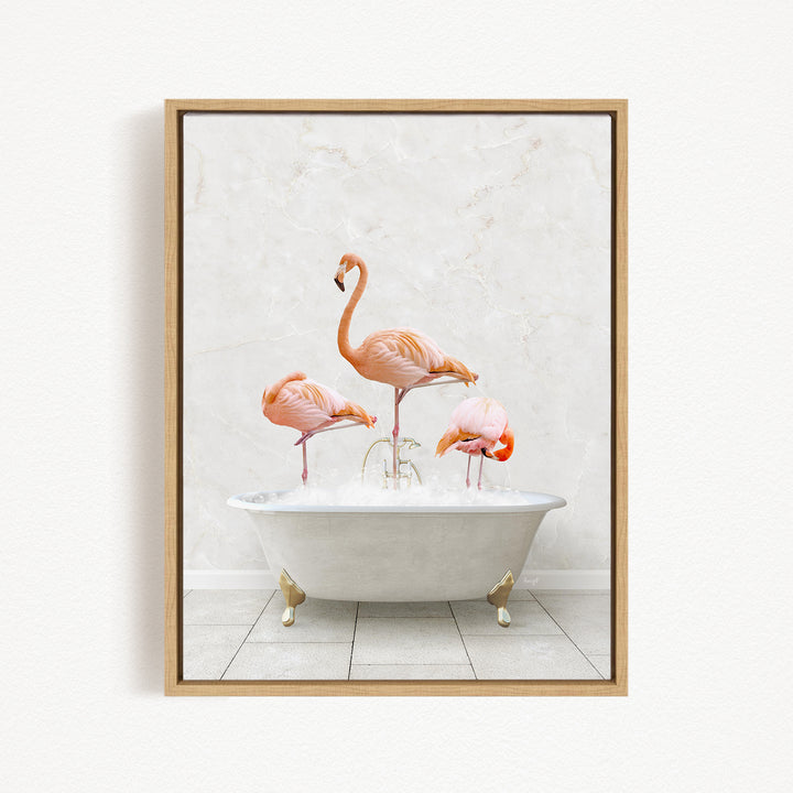 A framed image depicting three flamingos standing in a white bathtub filled with water.