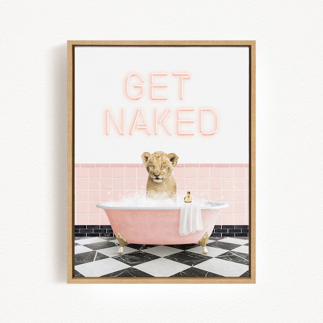 A framed image depicting a lion sitting in a pink bathtub, with the text "GET NAKED" displayed above it.