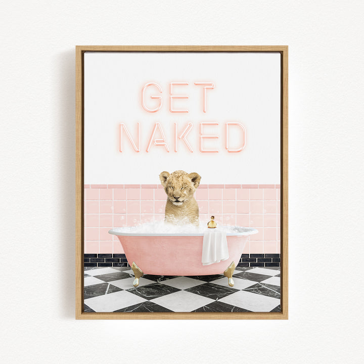 A framed image depicting a lion sitting in a pink bathtub, with the text "GET NAKED" displayed above it.