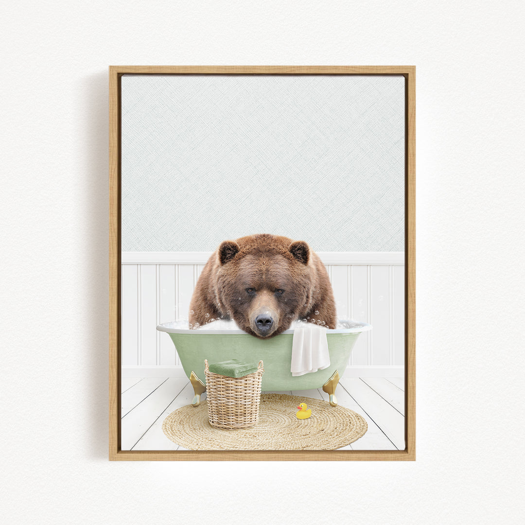 A brown bear is sitting in a green bathtub, surrounded by a basket of toys and a yellow rubber duck, creating a whimsical and playful scene.