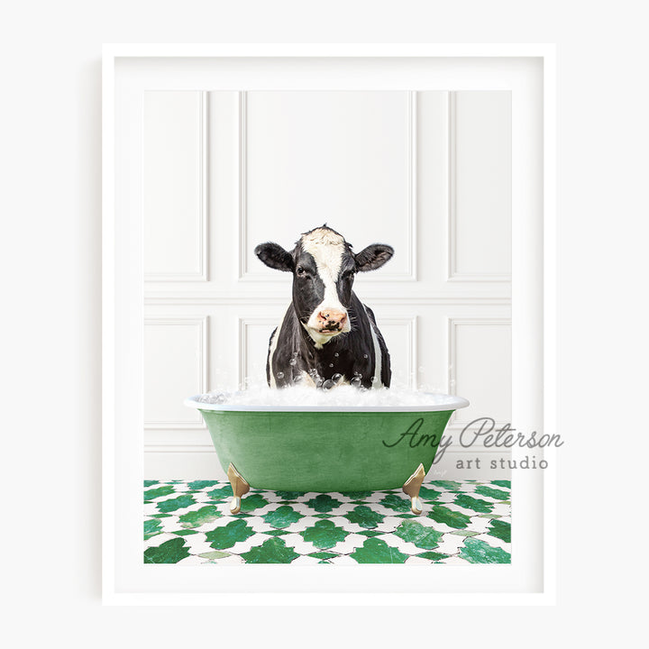 a black and white cow in a green bath tub