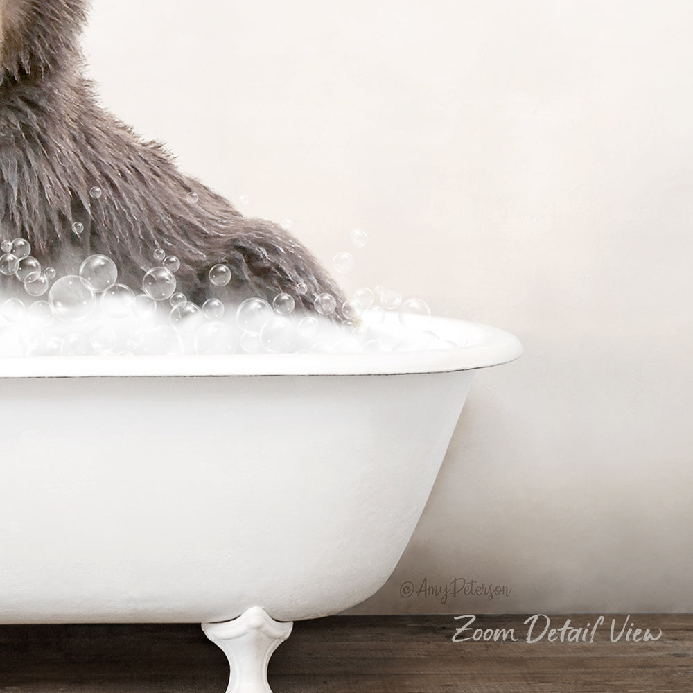 A fluffy gray cat is sitting in a white bathtub filled with bubbles, creating a cozy and playful scene.