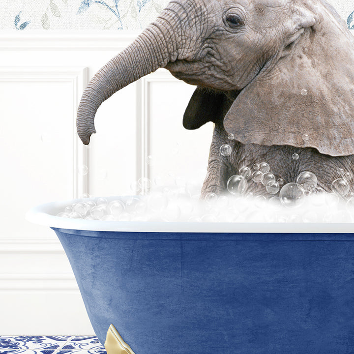 a baby elephant in a bathtub with bubbles