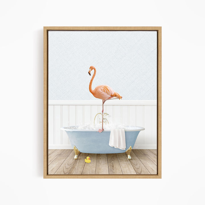 A pink flamingo stands on the edge of a blue bathtub filled with water, with a white towel hanging on the side.