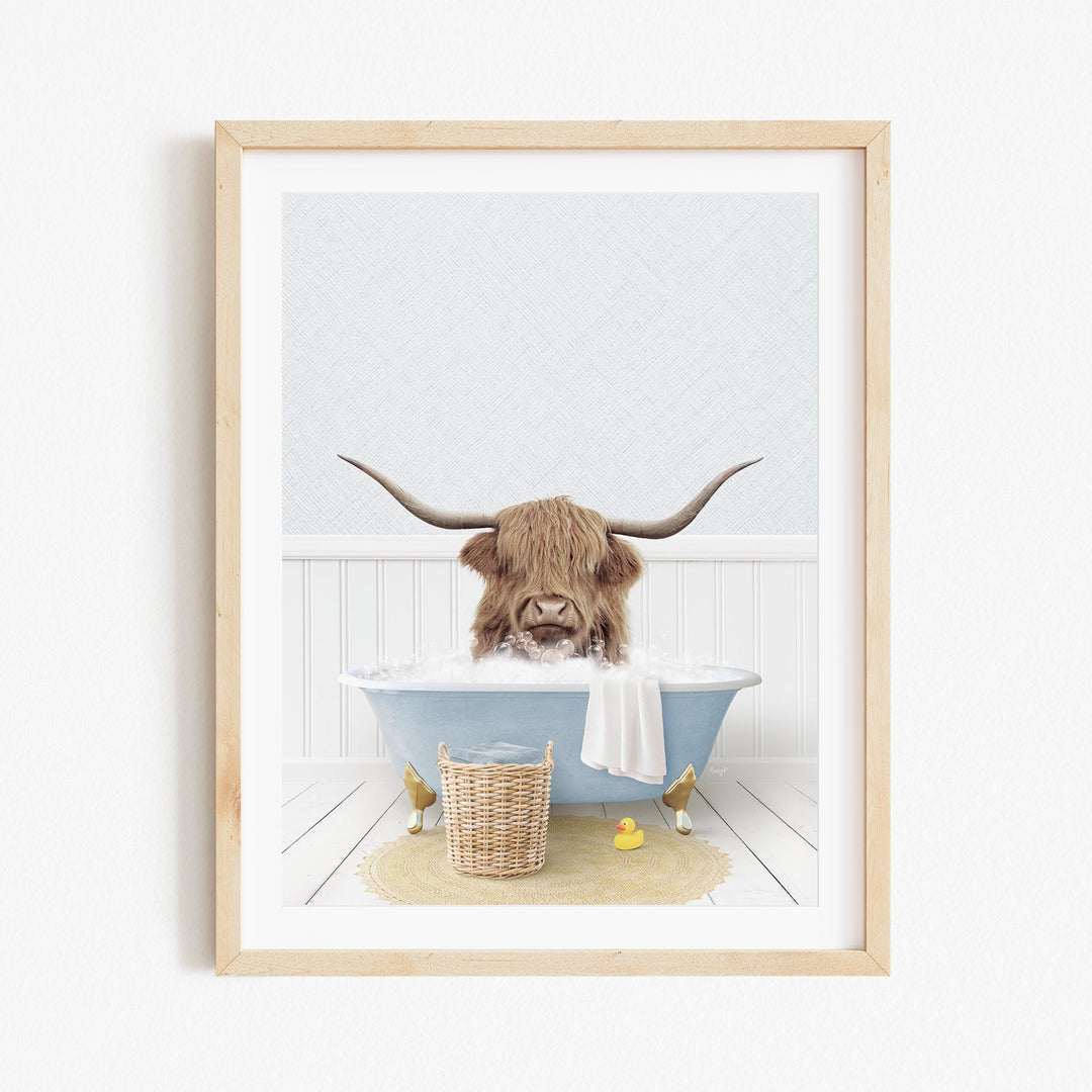 A brown cow with long horns is sitting in a blue bathtub filled with water, surrounded by rubber ducks.