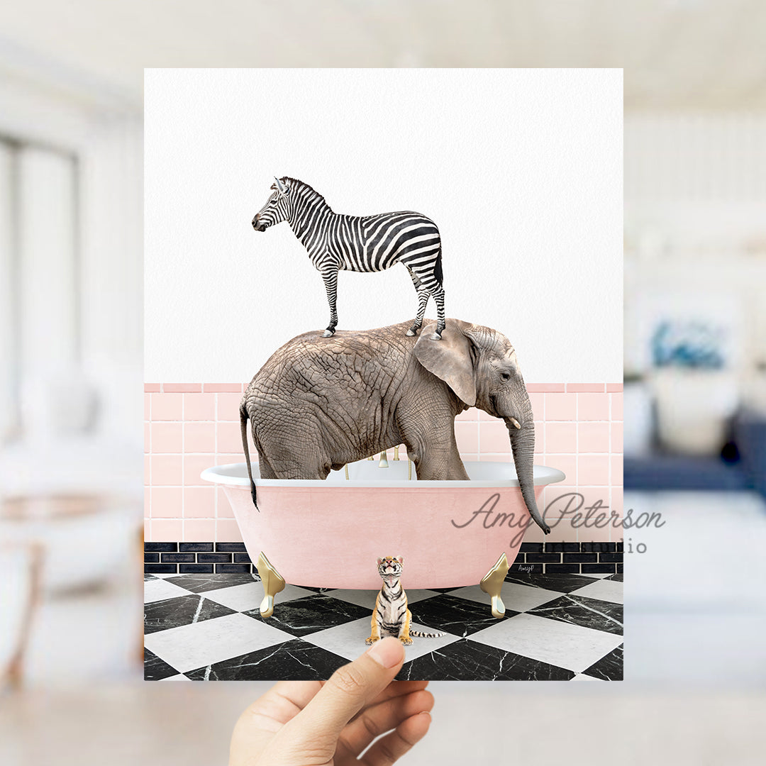 a person holding up a card with a picture of a zebra and an elephant in