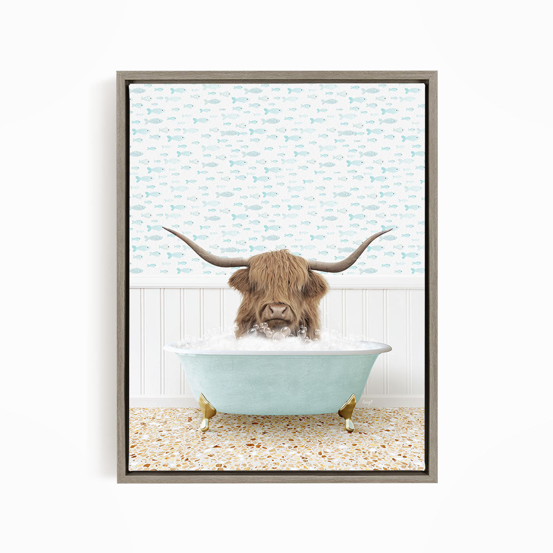 A brown cow with long horns is sitting in a light blue bathtub filled with water, surrounded by a pattern of fish.