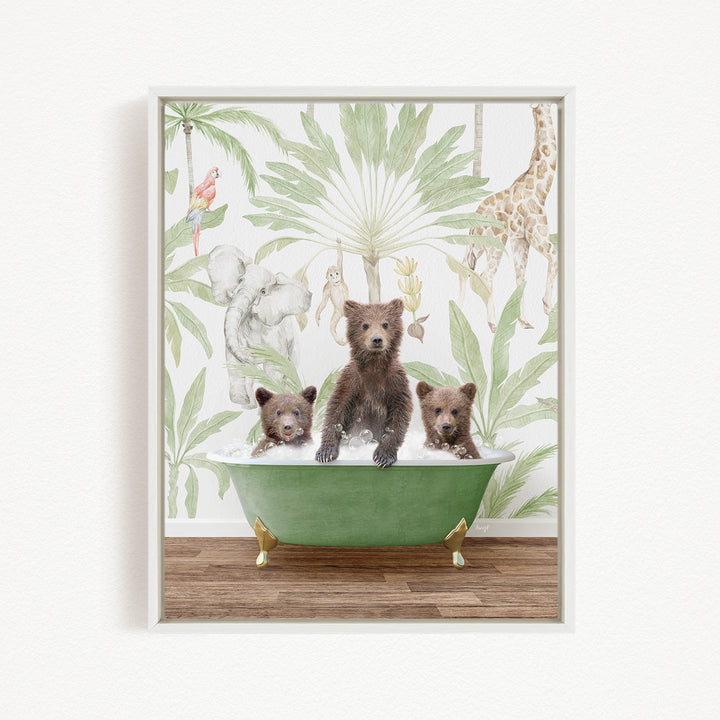 A framed print depicting three bears sitting in a green bathtub, surrounded by a tropical jungle wallpaper with various animals and plants.
