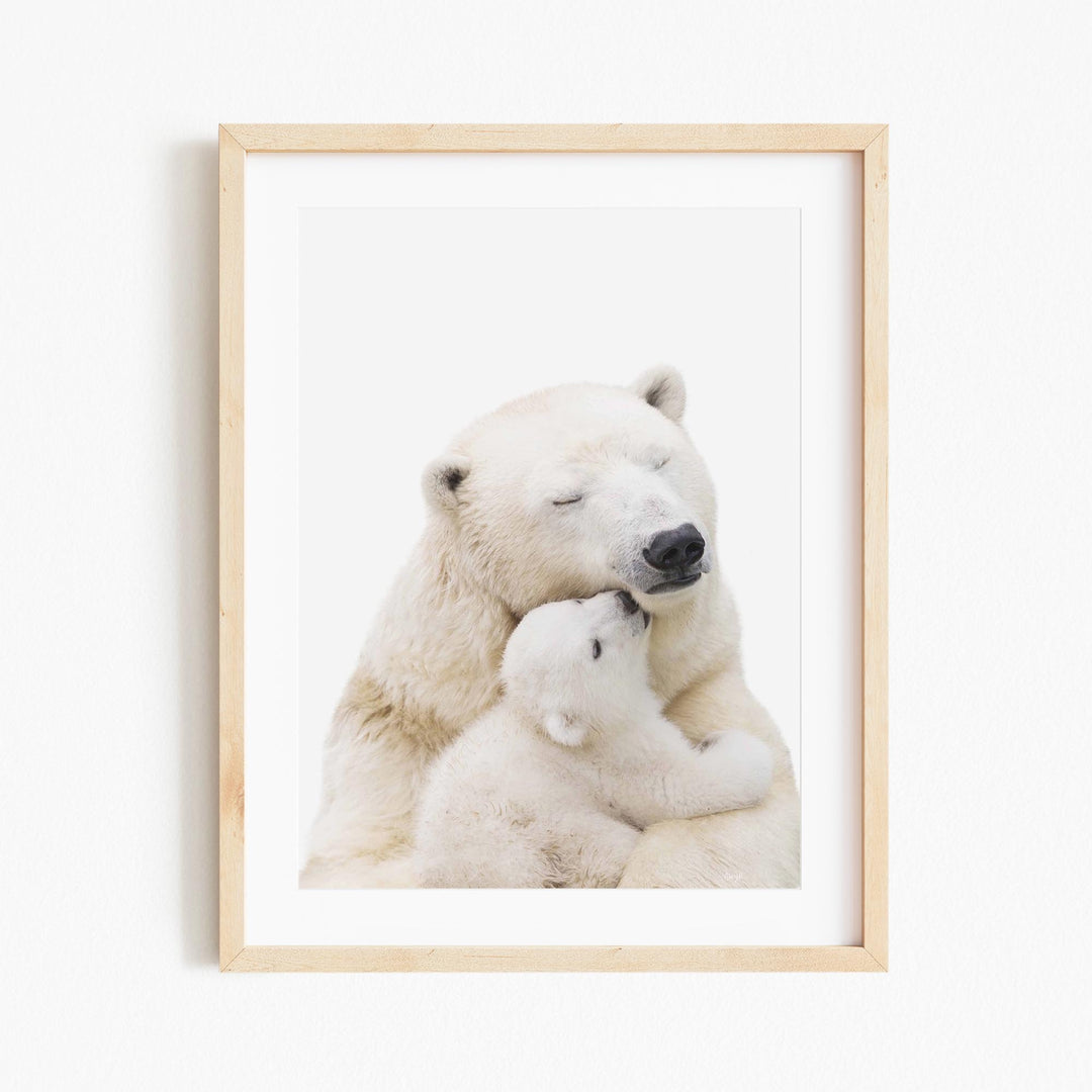 a polar bear holding a baby polar bear