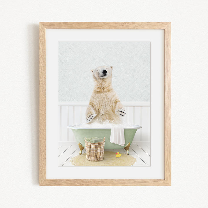 A polar bear sitting in a green bathtub filled with water, surrounded by rubber ducks and a basket.