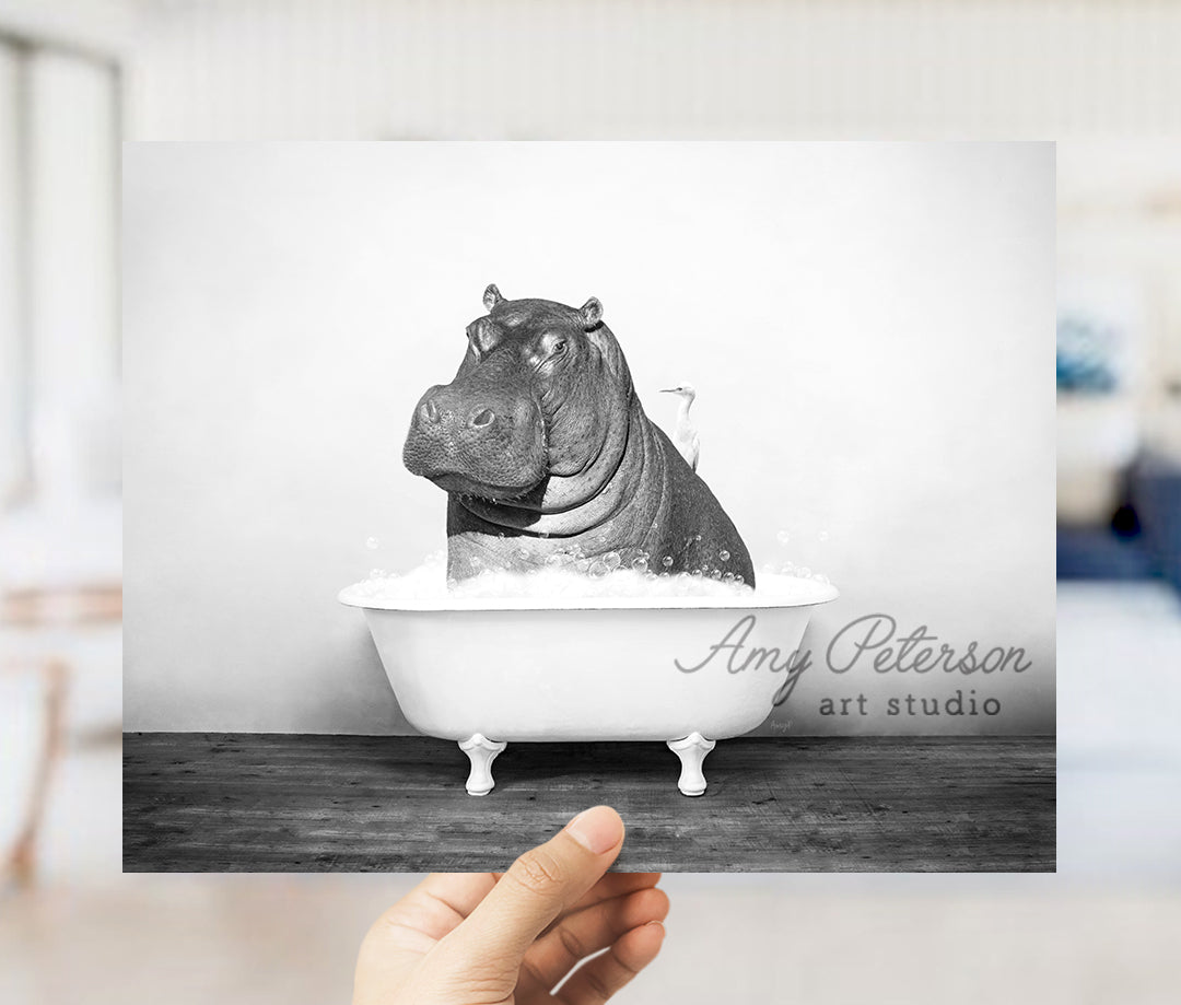 a hippo sitting in a bathtub with the caption art studio