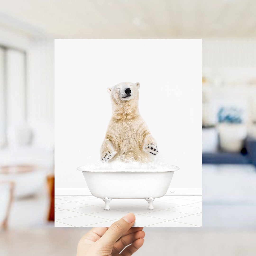 A polar bear standing in a bathtub filled with water, with its paws raised in the air.