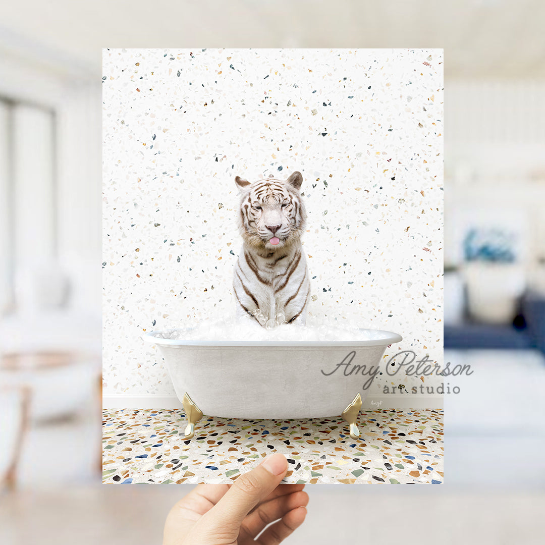 a white tiger sitting in a bath tub