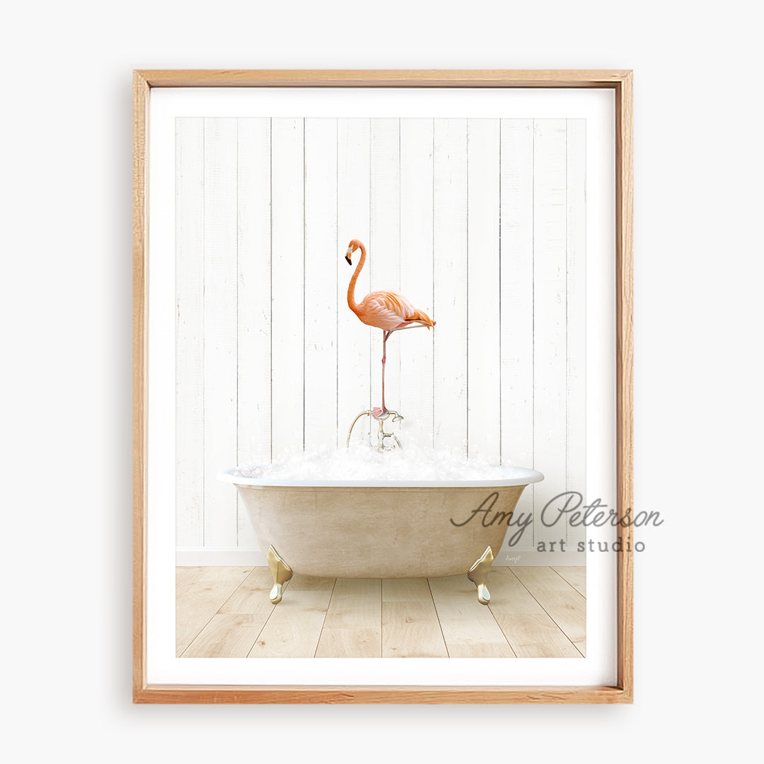 a pink flamingo standing on top of a bathtub