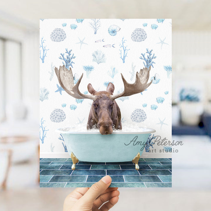 a person holding up a card with a picture of a moose in a bathtub