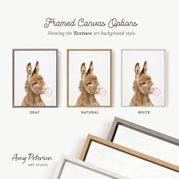 three framed canvas options, each featuring a donkey blowing a bubble with a different colored bubble gum. The options are labeled as "GREY," "NATURAL," and "WHITE."