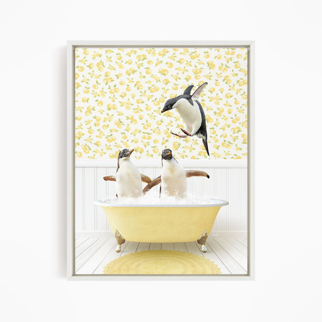 A framed image depicting two penguins sitting in a yellow bathtub, with one penguin jumping out of the tub.