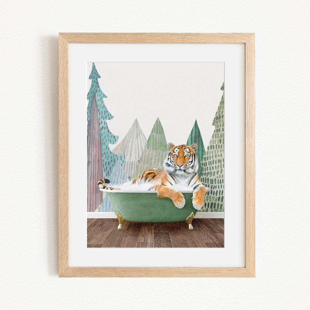A tiger is sitting in a green bathtub, surrounded by a forest scene with trees and mountains in the background.
