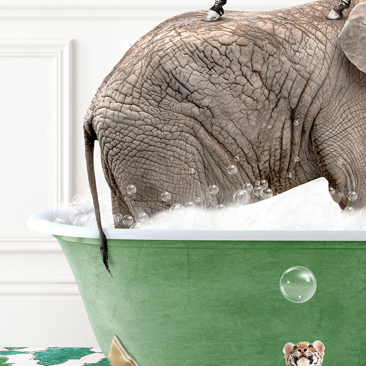 an elephant is taking a bath in a green tub