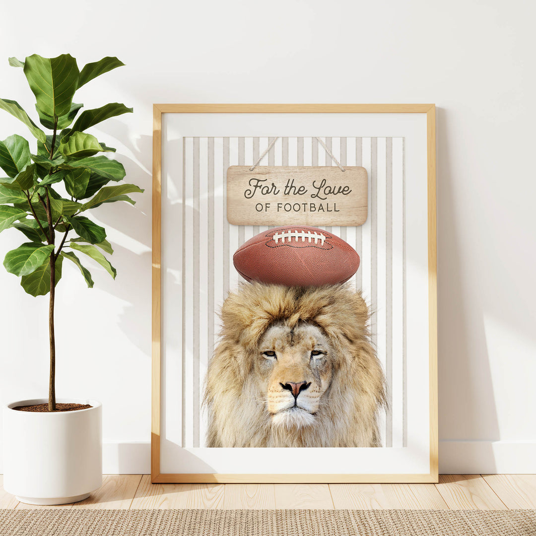 A framed poster featuring a lion with a football on its head, accompanied by the text "For the Love of Football".